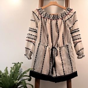 Cream and black striped off-the-shoulder romper.